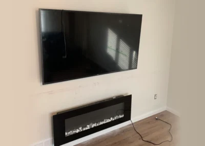 Mounted TV and Fireplace